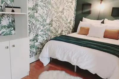 Un ou plusieurs lits dans un hébergement de l'établissement T1 cocooning à l’Hôtel de Ville