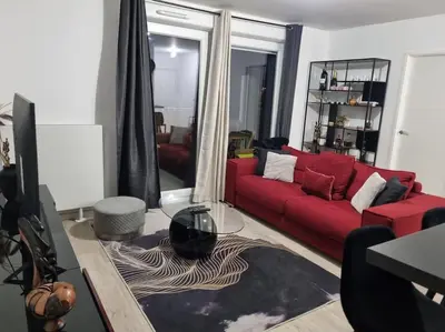 Coin salon dans l'établissement Appartement cosy et équipé