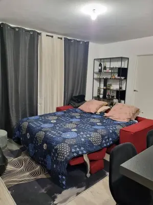 Un ou plusieurs lits dans un hébergement de l'établissement Appartement cosy et équipé