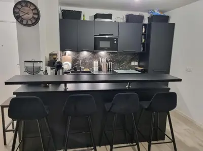 Cuisine ou kitchenette dans l'établissement Appartement cosy et équipé