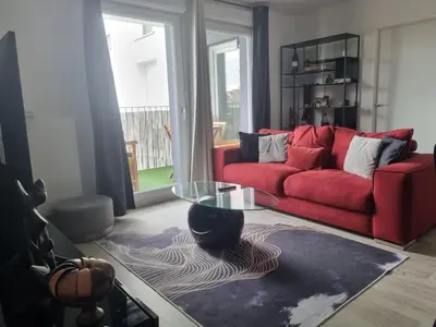 Coin salon dans l'établissement Appartement cosy et équipé