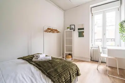 Un ou plusieurs lits dans un hébergement de l'établissement Le Zola - charmant 2 chambres - centre gare