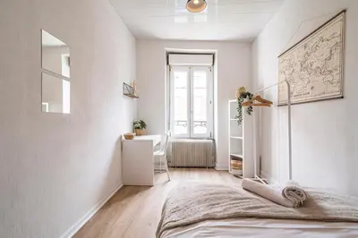 Un ou plusieurs lits dans un hébergement de l'établissement Le Zola - charmant 2 chambres - centre gare