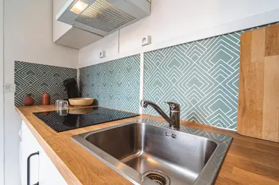 Cuisine ou kitchenette dans l'établissement Le Zola - charmant 2 chambres - centre gare