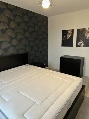 Un ou plusieurs lits dans un hébergement de l'établissement Gite 5 chambres, piscine intérieure, proche du Der