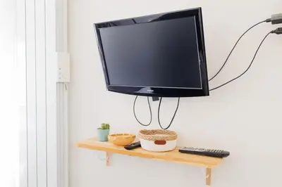 Télévision ou salle de divertissement dans l'établissement L'appart Cosy -Proche Disney