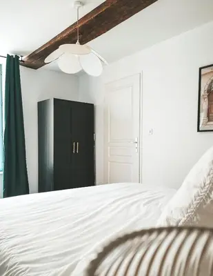 Un ou plusieurs lits dans un hébergement de l'établissement Appartement vue sur château-fort 3 étoiles