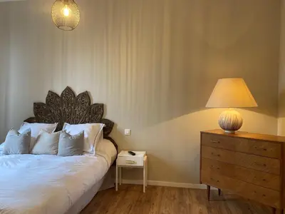 Un ou plusieurs lits dans un hébergement de l'établissement Appartement Complet Rez-de-chaussée