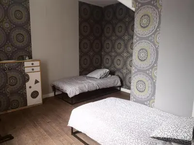 Un ou plusieurs lits dans un hébergement de l'établissement Le repos bien mérité
