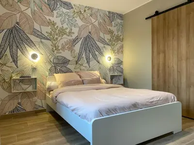 Un ou plusieurs lits dans un hébergement de l'établissement Gite du Pavillon