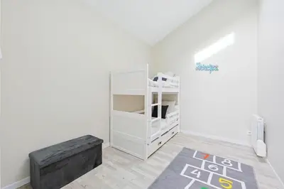 Un ou plusieurs lits dans un hébergement de l'établissement La Maisonnette 20 minutes de Disney