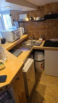Cuisine ou kitchenette dans l'établissement Super Studio meublé avec piscine partagée