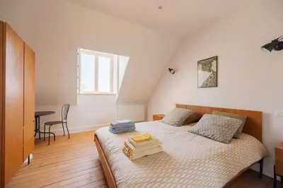 Un ou plusieurs lits dans un hébergement de l'établissement Villa Lenoir