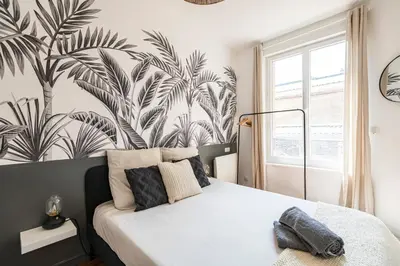 Un ou plusieurs lits dans un hébergement de l'établissement Immeuble spacieux - hyper centre - 15 couchages