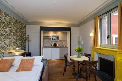 Un ou plusieurs lits dans un hébergement de l'établissement Villa Forestière Studio Le Sophora