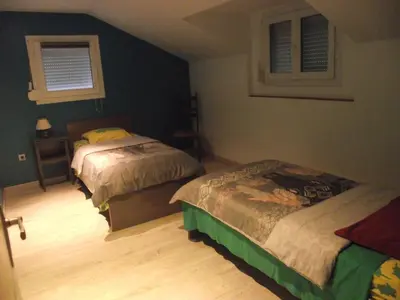 Un ou plusieurs lits dans un hébergement de l'établissement Maison chez DANETTE