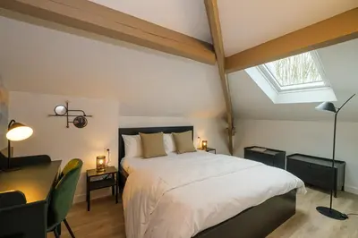 Un ou plusieurs lits dans un hébergement de l'établissement Villa Forestière Appart Le Cèdre