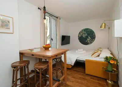 Un ou plusieurs lits dans un hébergement de l'établissement Villa Forestière Appart. Le Paulownia